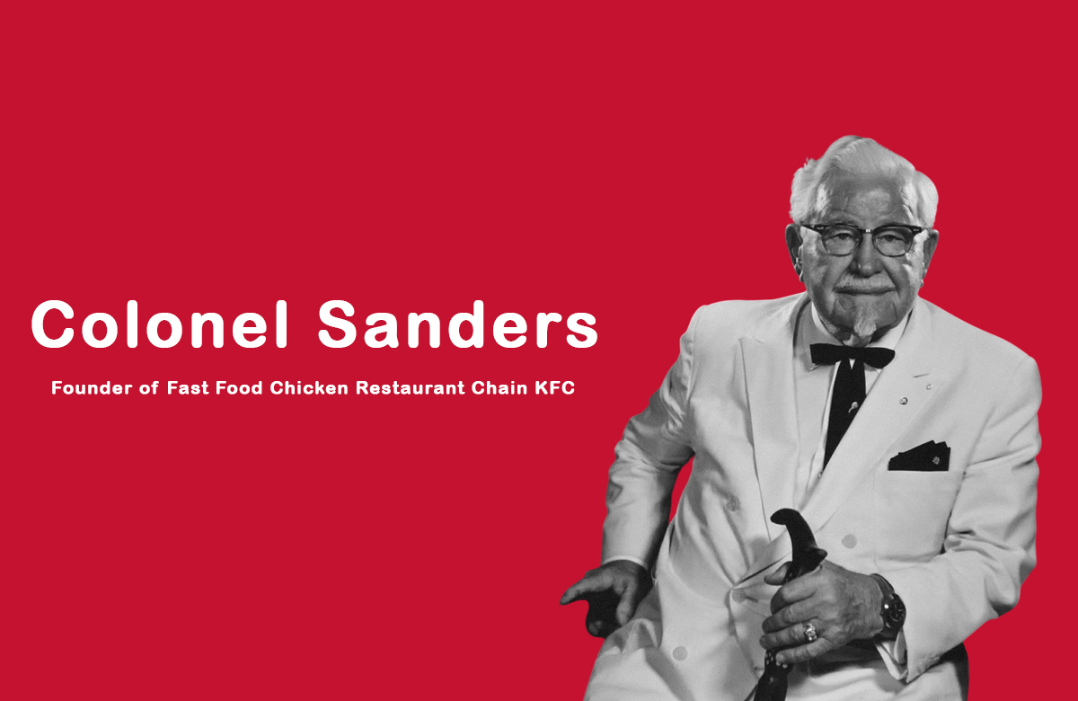 Colonel Sanders in his signature white suit holding a bucket of fried chicken